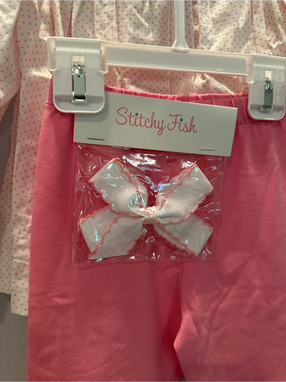 Girls' Pink Smocked Top & Legging Set with Matching Bow.